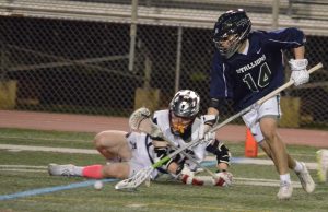 Tim scooping a ground ball vs. Woodson.